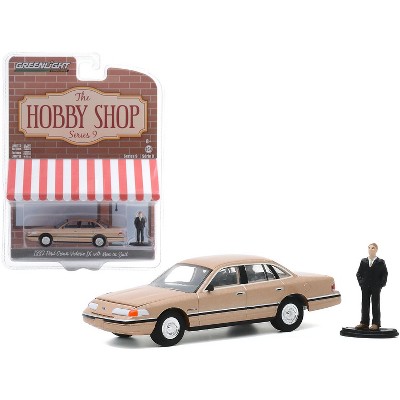 1992 Ford Crown Victoria LX Gold Metallic with Man in Suit Figurine "The Hobby Shop" Series 9 1/64 Diecast Model Car by Greenlight