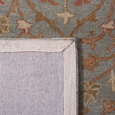 Elegant Heritage Hand-Tufted Wool Round Rug in Light Blue