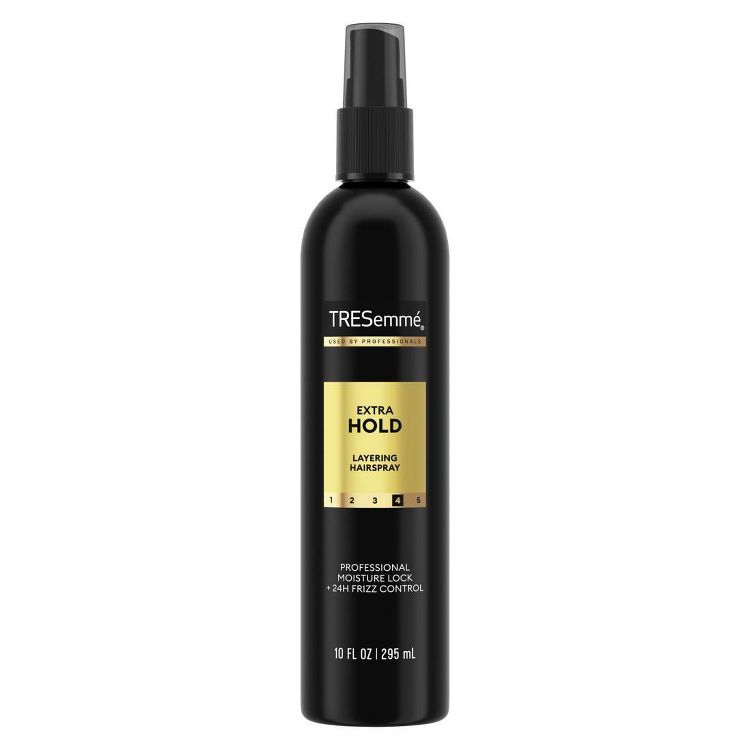 Black colored bottle of TRESemmé Extra Hold Layering Hairspray with a 10 fl oz (295 ml) label.