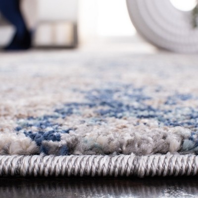 4' x 6' Gray and Navy Abstract Synthetic Area Rug