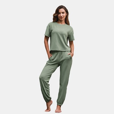 A woman wearing a green loungewear set