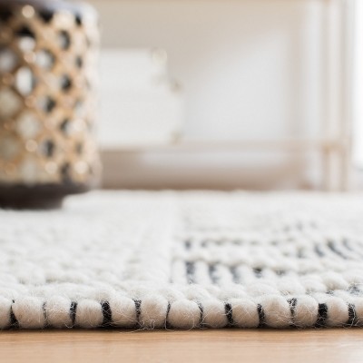 Ivory and Black Geometric Wool 3' x 5' Area Rug