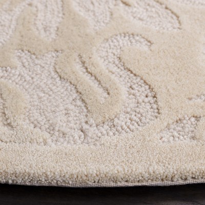 Ivory Hand-Knotted Round Wool and Synthetic Rug