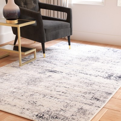 Ivory and Grey Abstract Round Synthetic Rug, 3' x 5'