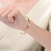 14K Gold-Plated Cuff Bracelet featuring sparkling Cubic Zirconia, blending luxurious gold tones with radiant brilliance for an elegant statement piece - 2 of 3