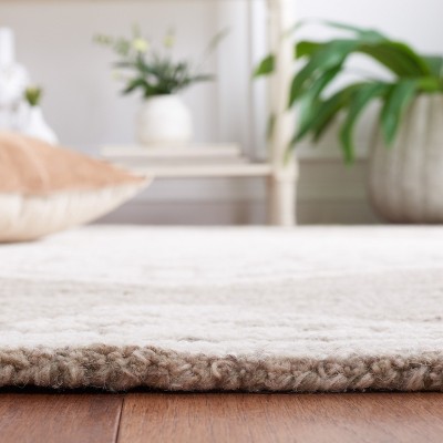 Handmade Ivory Abstract Tufted Wool Round Rug