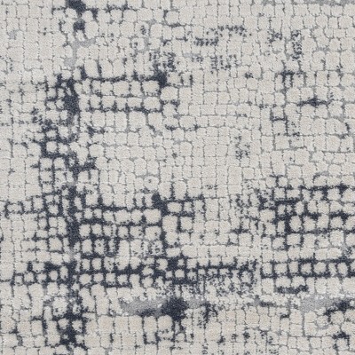 Ivory and Blue Abstract Synthetic 2'2" x 7'6" Area Rug