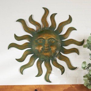 Metal Sun Wall Decor with Smiling Face and Curved Rays Copper - Olivia & May - 1 of 4