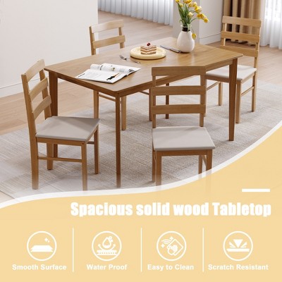 Dining table set with four chairs shown from a different angle