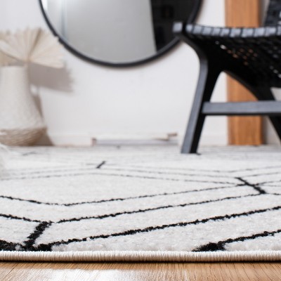 Ivory and Black Geometric 8' x 10' Synthetic Area Rug