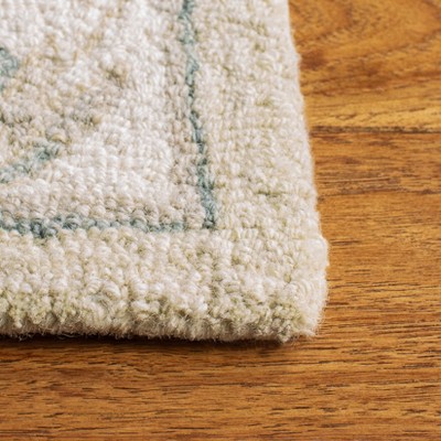 Handmade Beige and Ivory Wool Tufted Area Rug