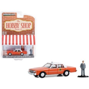 1981 Chevrolet Impala "Capitol Cab" Taxi Orange with White Top and Man in Suit Figure 1/64 Diecast Model Car by Greenlight - 1 of 3