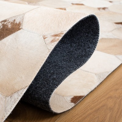 Ivory and Brown Geometric Cowhide 4' x 6' Area Rug