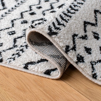 8' x 10' Black and Ivory Geometric Synthetic Area Rug