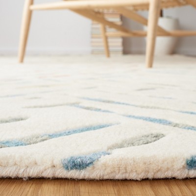 Ivory and Blue Hand-Tufted Wool 6' x 9' Area Rug