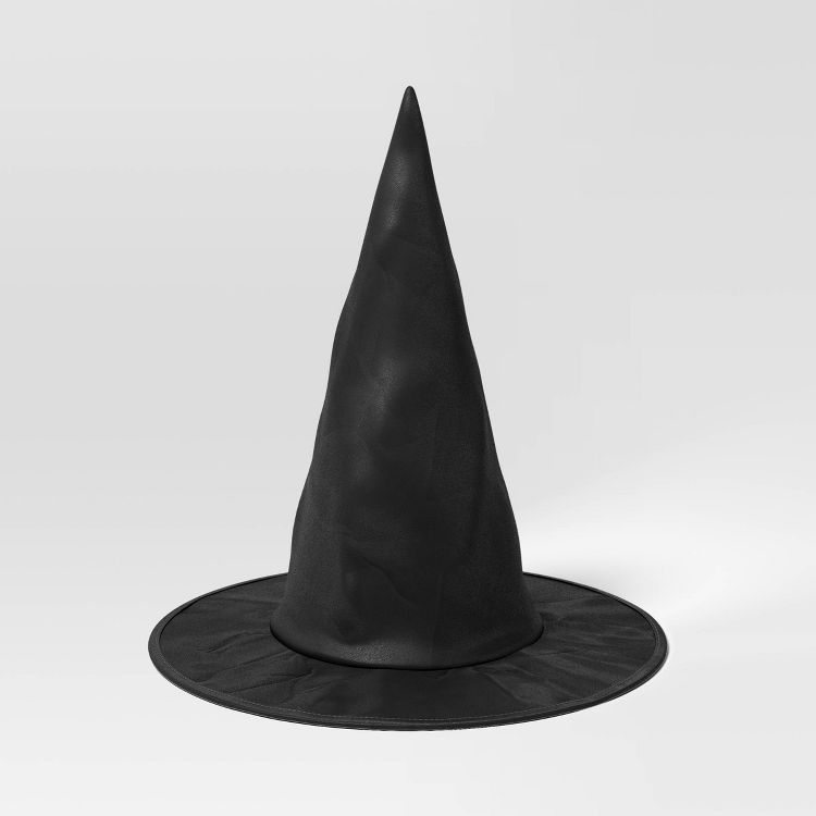 A black colored pointed witch hat with a wide brim on a plain background.