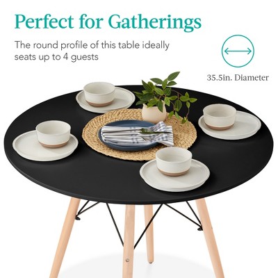 Compact Black Round Mid-Century Modern Dining Table with Beech Wood Legs
