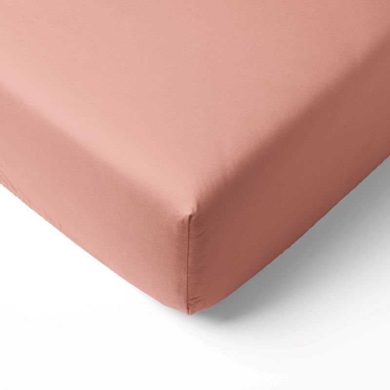 Bacati - Solid Coral Pink 100 percent Cotton Universal Baby US Standard Crib or Toddler Bed Fitted Sheet, 1 of 7