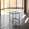 HomeRoots 48" Clear And Black Glass And Iron Round Top Dining Table - 2 of 4