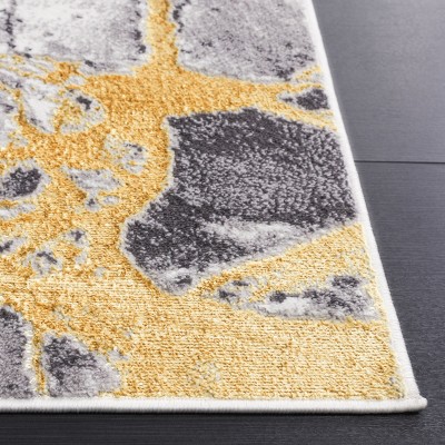 Ivory and Gold Modern Abstract 4' x 6' Synthetic Rug