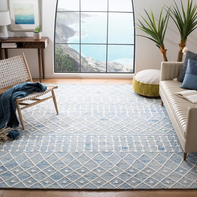 Blue and Ivory 6' x 9' Hand Tufted Wool Floral Area Rug