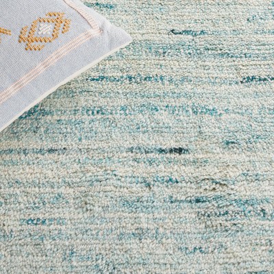 Ivory and Turquoise Handwoven Wool Shag Area Rug, 5' x 8'