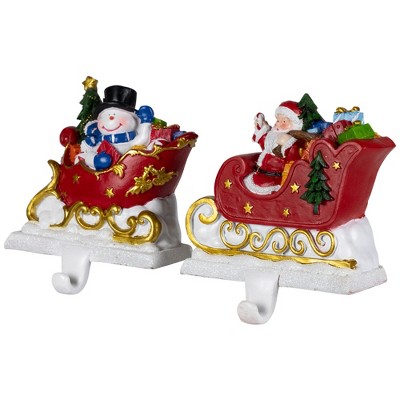 Santa and Snowman Sleigh Ride Resin Stocking Holders Set