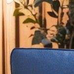 blue cushion/brown wicker