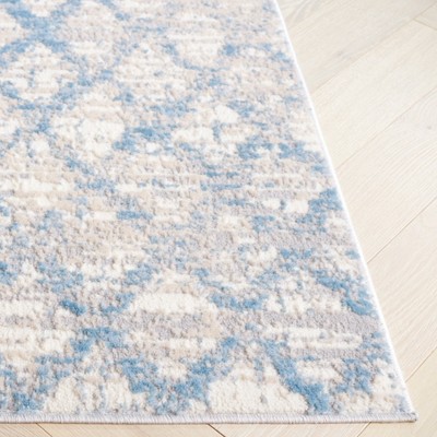 Ivory Abstract 5' x 7' Hand-Knotted Synthetic Area Rug
