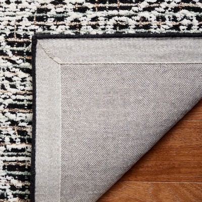 Handmade Black Wool 6' x 9' Tufted Area Rug