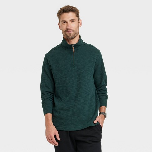 Dark green store quarter zip