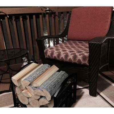 Black Curved Metal Firewood Rack with Decorative Scroll Design