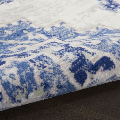 Ivory Blue Floral Synthetic 5' x 7' Reversible Area Rug