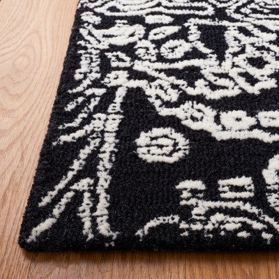 Black and Ivory Floral Hand-Tufted Wool 6' x 9' Area Rug