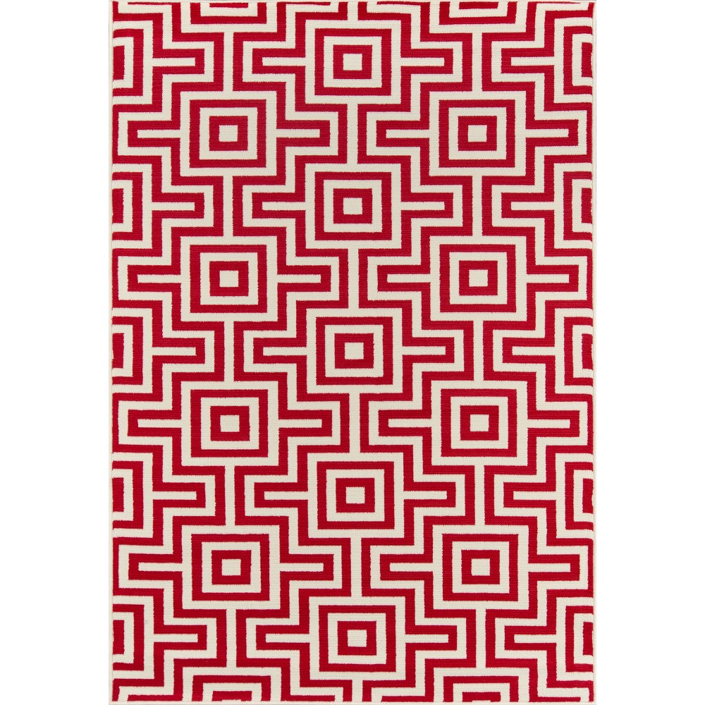 6'7 x9'6  Solid Area Rug Red - Momeni This elegant indoor/outdoor all-weather area rug offers everything you need to complete the ultimate outdoor room. Repeating stripes, diamonds, trellis and arabesque shapes meet nautical icons like ropes, anchors and waves, adding a luxe layer to all interior and exterior living spaces, including patios, porches and pool decks. Durable power-loomed construction ensures each decorative floorcovering transitions beautifully from season to season while the vibrant color palette and enduring polypropylene fibers offer endless design possibilities indoors and out. Size: 6'7 X9'6 . Color: Red. Pattern: Solid.