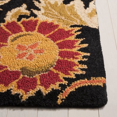 Handmade Black and Multicolor Floral Wool Rug, 2' x 3'