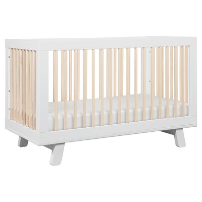 natural wood and white crib