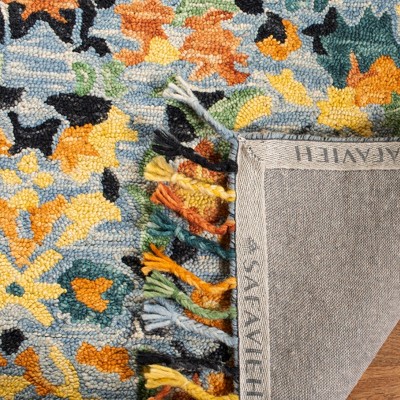 Handmade Blue Wool Floral Rectangular Area Rug with Tassels