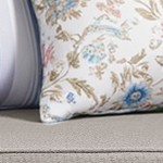 gray cushion/brown wicker