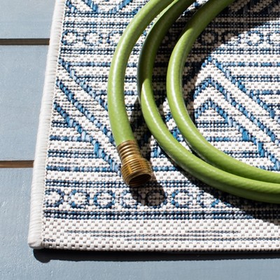 Ivory and Navy Geometric Reversible Synthetic Square Rug