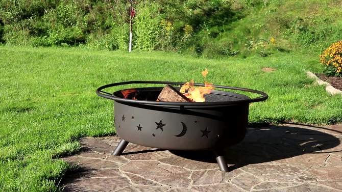 Sunnydaze Outdoor Camping or Backyard Steel Round Cosmic Fire Pit with Spark Screen and Log Poker - 41.5" - Black, 2 of 11, play video