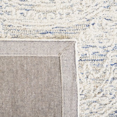 Ivory and Blue Handmade Wool Abstract Tufted Area Rug, 8' x 10'