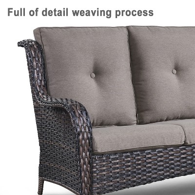 Close-up of sofa arm with woven wicker and cushion