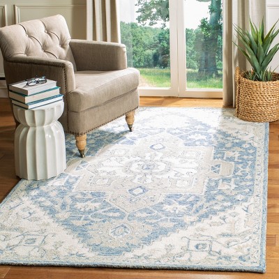Handmade Blue and Ivory Wool 4' x 6' Tufted Area Rug