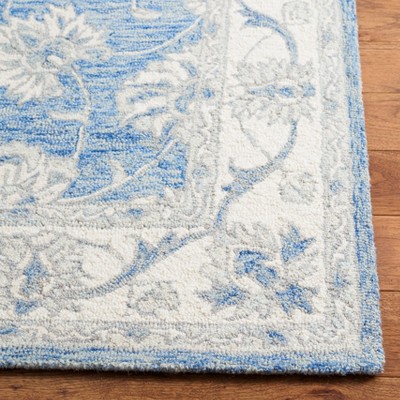 Handmade Blue and Ivory Wool 4'x6' Area Rug