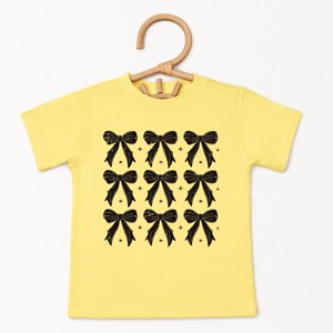 The Juniper Shop Coquette Black Bows Collage Distressed Toddler Short Sleeve Tee - 1 of 4