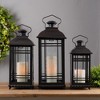 Black Metal Lantern Set of Three with Glass Panels 20in 17in and 14in Decorative Accent By Melrose - 2 of 3