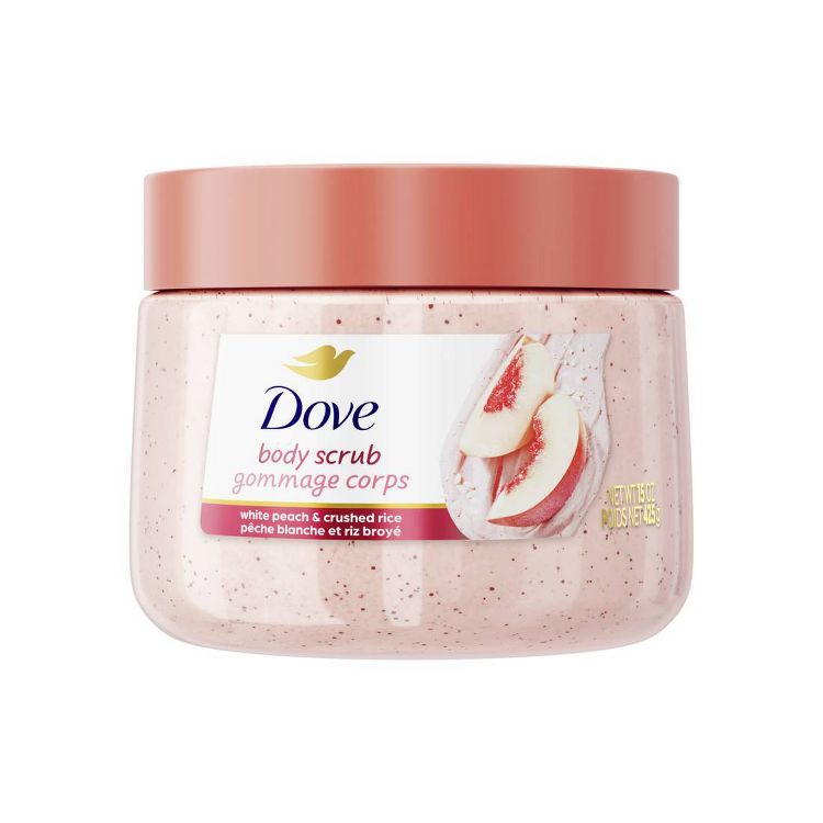 Dove Body Scrub, White Peach & Crushed Rice, 10.5 oz. The jar is light pink with a matching peach-colored lid. It features the iconic Dove logo in blue and gold, and an image of white peach slices, highlighting its exfoliating benefits.