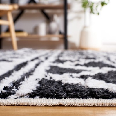 Augustine Black and Ivory Flat Woven Synthetic Area Rug
