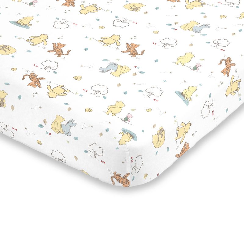 Disney Winnie the Pooh Classic Pooh 100% Cotton Fitted Crib Sheet in Ivory, Butter, Aqua and Orange, 1 of 4